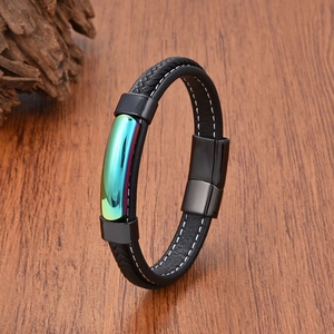 Detail of men's black braided leather bracelet with iridescent metal and magnetic clasp