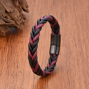 Detail of woven black and burgundy leather cord bracelet with matte magnetic clasp