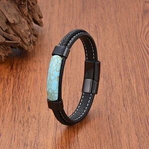 Detail of men's leather bracelet with turquoise stone inlay and magnetic clasp