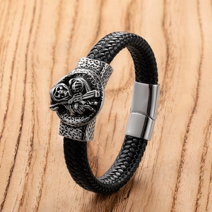 Men's black braided leather bracelet with vintage steel skull and magnetic clasp