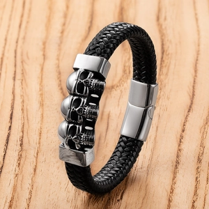 Punk woven leather bracelet with silver skull charms and magnetic stainless steel clasp