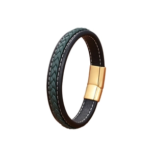 Men's woven leather bracelet with dark green and black layers and a gold magnetic clasp