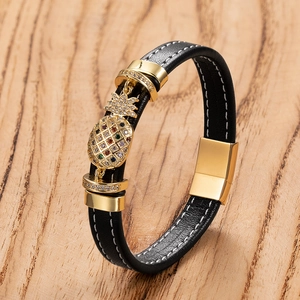 Men's black woven leather bracelet with a gold crystal pineapple charm and magnetic clasp