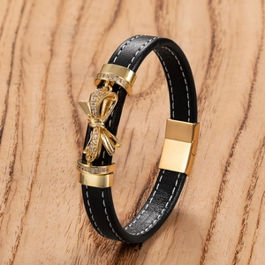 Chic bracciale in pelle nera con fiocco scintillante e chiusura magnetica dorata da donna