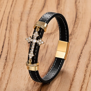 Mens woven black leather bracelet with a gold CZ cross charm and magnetic clasp