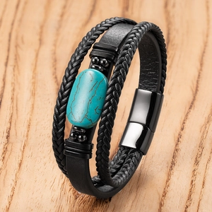 Detail of men's leather bracelet with woven cords, turquoise stone, and magnetic clasp