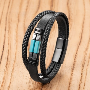 Macro view of multi-layer leather braid bracelet with blue stone and magnetic clasp