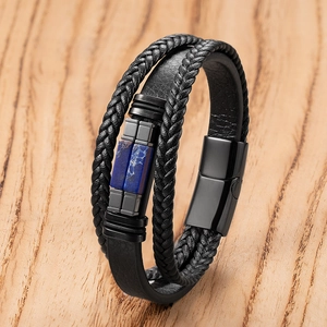Detail of men's multilayer braided leather bracelet with blue stones and metal magnetic clasp