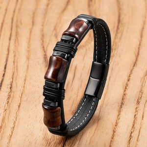 Bracciale da uomo in pelle nera intrecciata con pietre occhio di tigre e chiusura magnetica