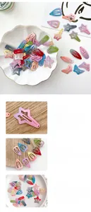 Détail de barrettes BB colorées en métal dégradé en formes d'étoile, cœur et papillon