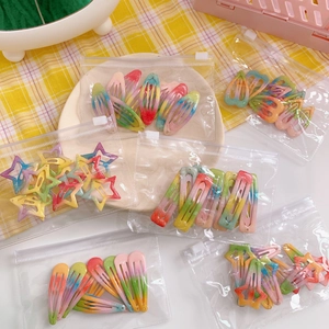 Rainbow gradient glitter snap hair clips set with stars in a clear zipper bag