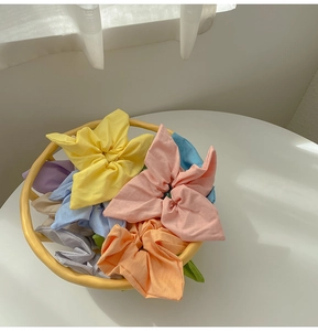Detail of colorful scrunchie set in soft cotton fabric with pastel macaron tones