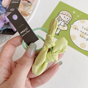 Élastique à cheveux avec nœud vert pastel en tissu texturé pour filles et femmes