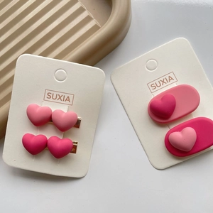 Sweet pink heart hair clips set for girls featuring matte resin bows and heart-shaped pins
