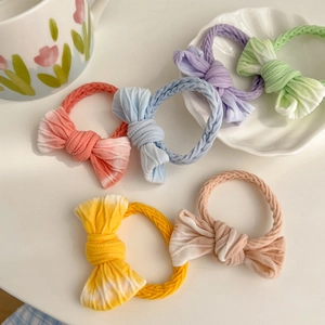 Detail of colorful gradient knit bow hair ties in six Morandi candy colors for girls