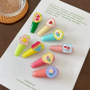 8-piece set of colorful kids candy color flower and rainbow hair clips on white book