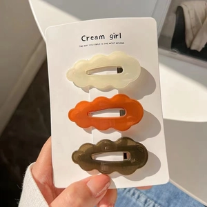 Three-piece set of cute cloud-shaped jelly hair clips in autumn colors on a card