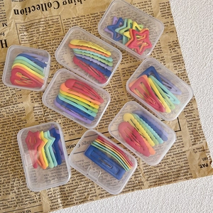 Rainbow matte BB clips set with stars and hearts in clear cases on vintage paper