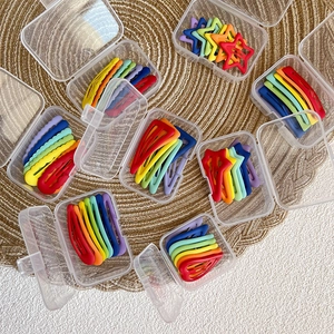 Rainbow matte star and heart hair clips set for kids in a clear storage box