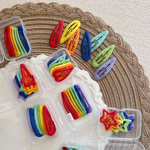 Rainbow matte star and teardrop hair clip set in a clear plastic storage box