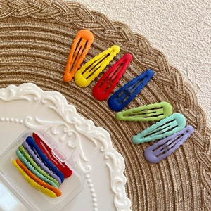 Set of colorful matte wave-shaped BB hair clips for girls in a clear storage case