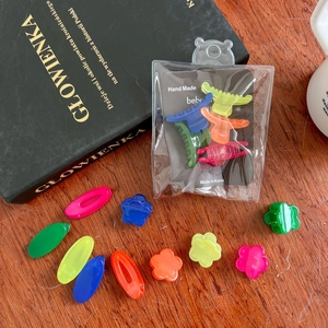 Detailed view of colorful mini jelly hair claws and clips on a display card