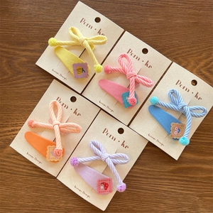 Five sets of colorful striped knotted bow hair clips for girls with cute cartoon embroidery