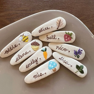 Set of 8 handmade embroidered bow hair clips with customized botanical and animal motifs