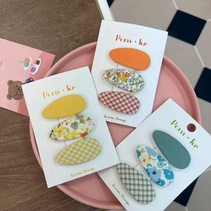 Floral and checkered fabric hair clips set for girls featuring sweet colorful patterns