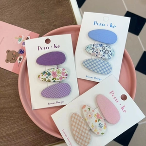 Three-piece Korean floral fabric BB hair clips set for kids on white display card