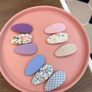 8-piece set of floral and checkered fabric hair clips for kids in various sweet colors