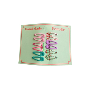 Set of 10 matte printed mini BB hair clips for girls on display card for daily hair styling