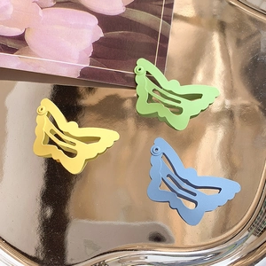 Three-piece butterfly hair clips set in pastel yellow, mint green and sky blue matte finish