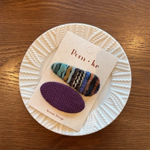 Korean style set of two hair clips featuring purple tweed and multicolor knit textures