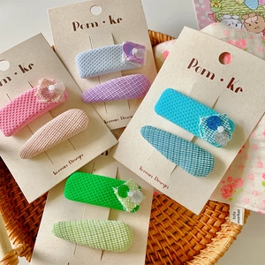 Detailed set of 4 pairs of sequin floral fabric hair clips in sweet candy colors