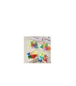 Detailed view of colorful mini plastic hair claws with measurement and packaging display