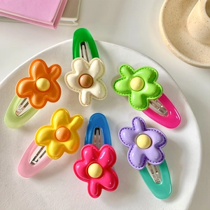 Set of six colorful flower hair clips in macabre pastel tones for girls hair styling
