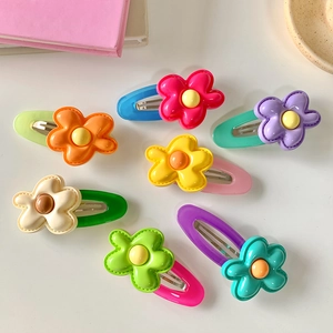 Set of 7 colorful floral resin snap clips for girls in various bright candy colors