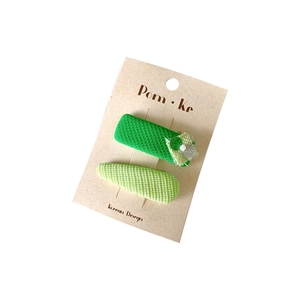 Sweet green fabric sequin hair clips set with rectangle and teardrop shapes on card