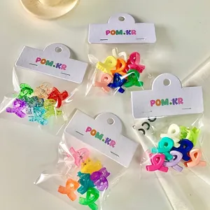 Set of colorful mini plastic hair claws for girls in vibrant candy colors and pastel tones