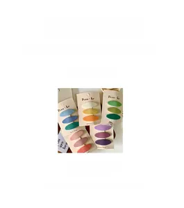 Detail view of handmade fabric oval hair clips in colorful gradient macaron shades