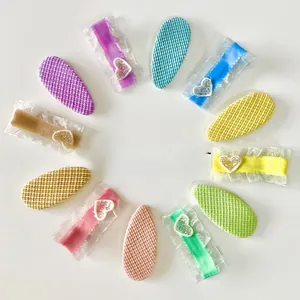 Detail of candy-colored lace hair clips with heart patterns for girls and toddlers