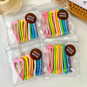 Colorful macaron candy color hair clips set in handmade packaging on white background