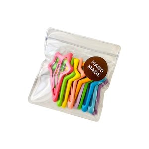 Set of 10 colorful candy-colored star hair clips in a transparent gift bag packaging