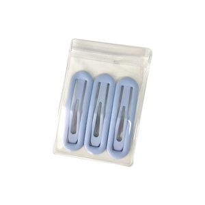 Lot de 3 barrettes ovales bleu clair mat dans une pochette zippée transparente