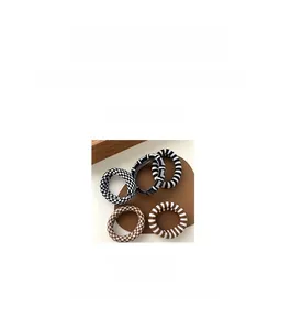 Detail view of 5cm checkered elastic hair ties with woven texture and durable design