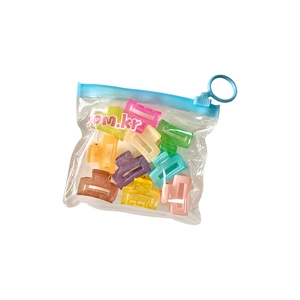 Set of colorful jelly mini hair claws in a clear hanging pouch for little girls