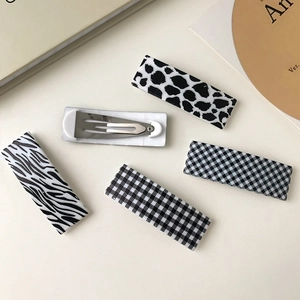 5-piece black and white patterned hair clip set with cow and checkerboard prints
