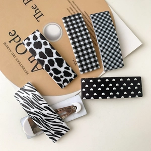 Five-piece rectangular hair clip set featuring leopard print and checkerboard patterns