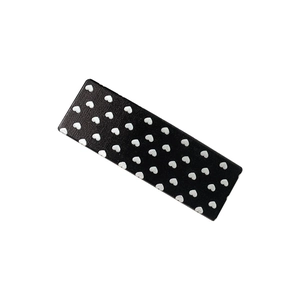 Minimalist black hair clip featuring white heart pattern on rectangular duckbill side slide